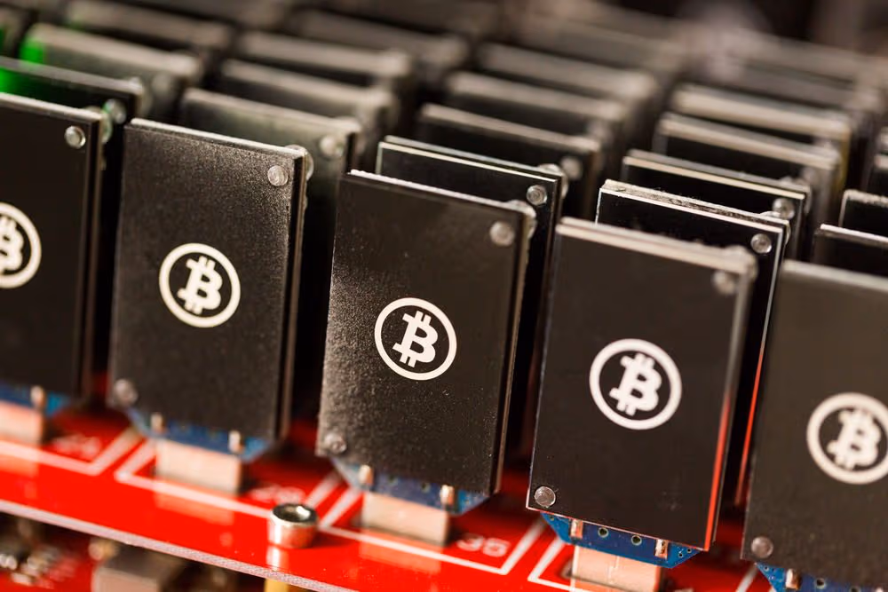 Bitcoin mining USB devices connected to a large USB hub.